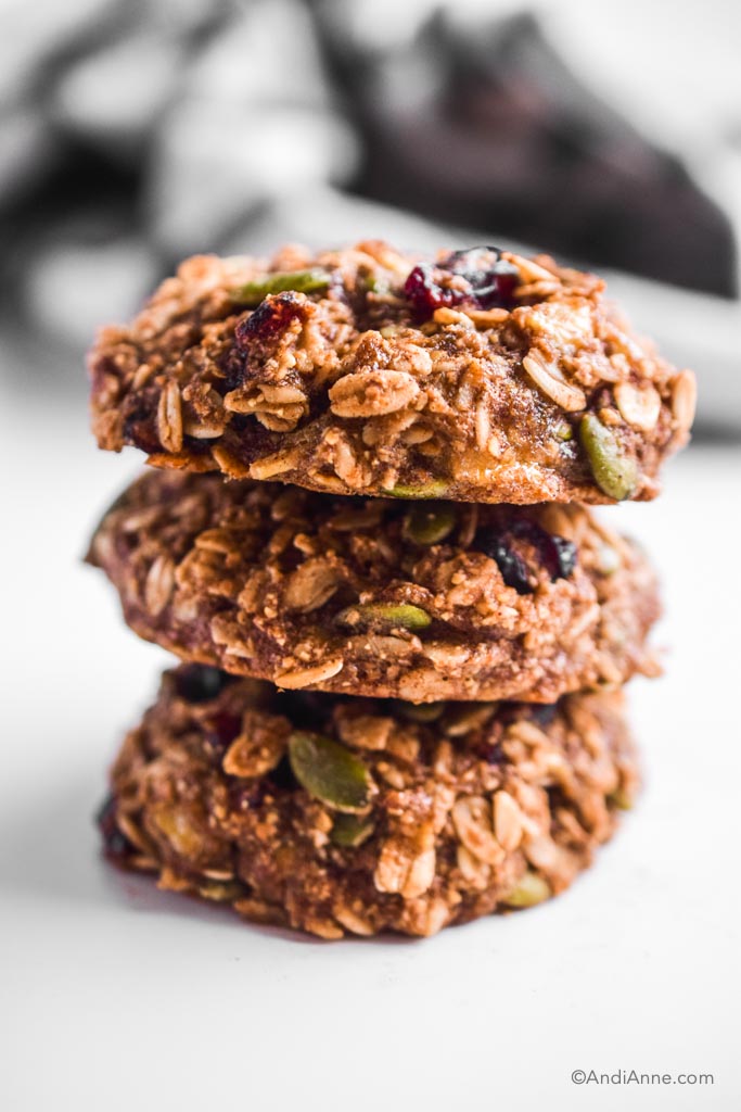three stacked breakfast cookies on top of eachother with white background