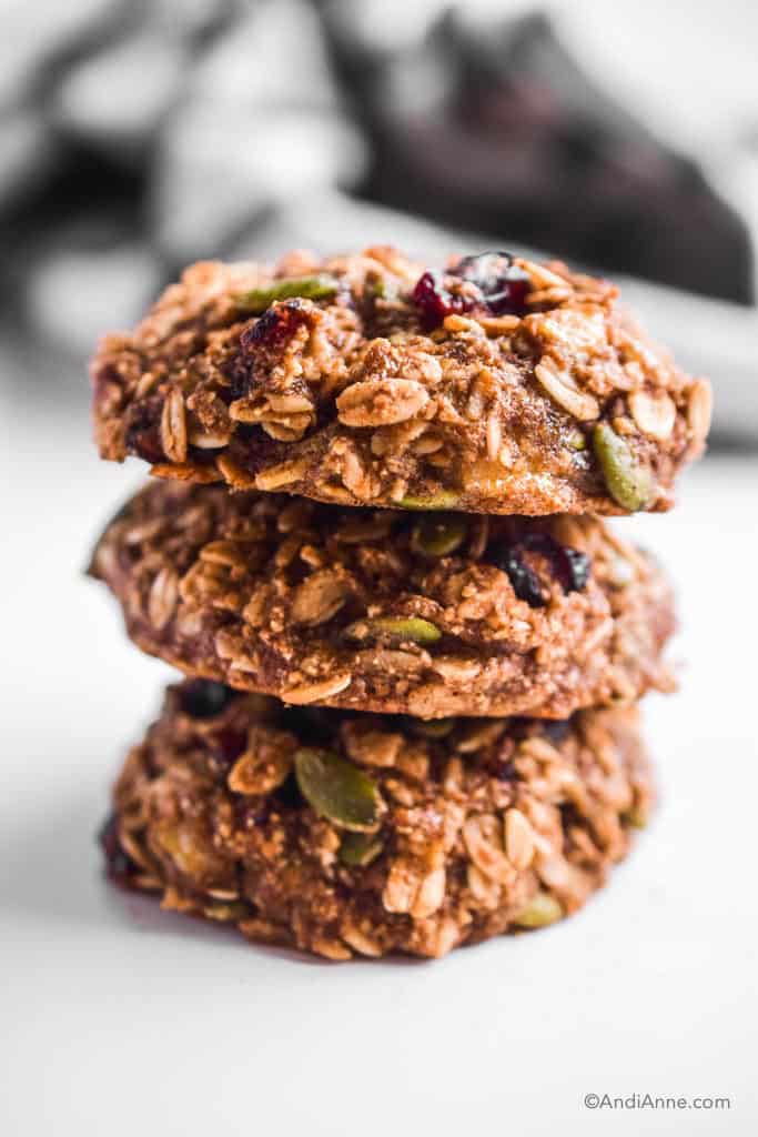 three stacked breakfast cookies on top of eachother with white background