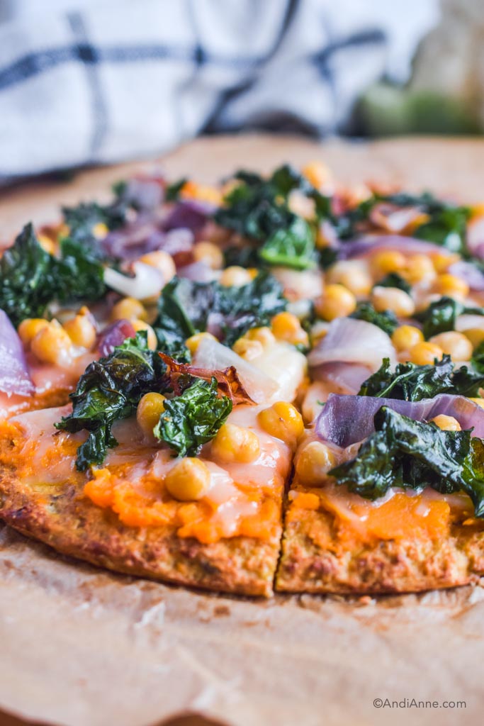 close up detail of side of kale chickpea cauliflower pizza