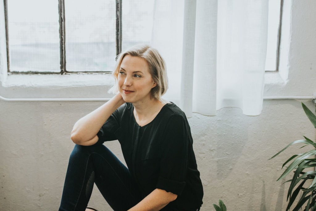 Picture of andi on a bench for the review of Institute of Integrative Nutrition