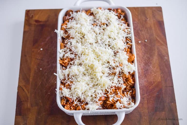 mozzarella cheese sprinkled on top of pasta mixture