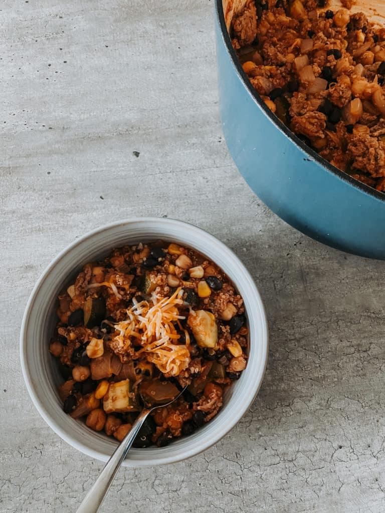 Turkey quinoa chili in a bowl with spoon