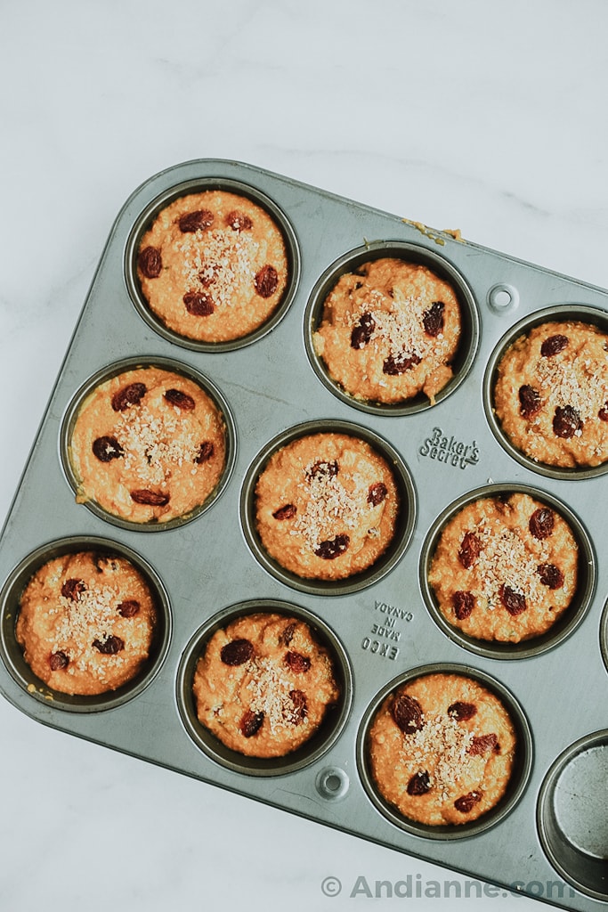 classic raisin bran muffins in a muffin tin before cooking
