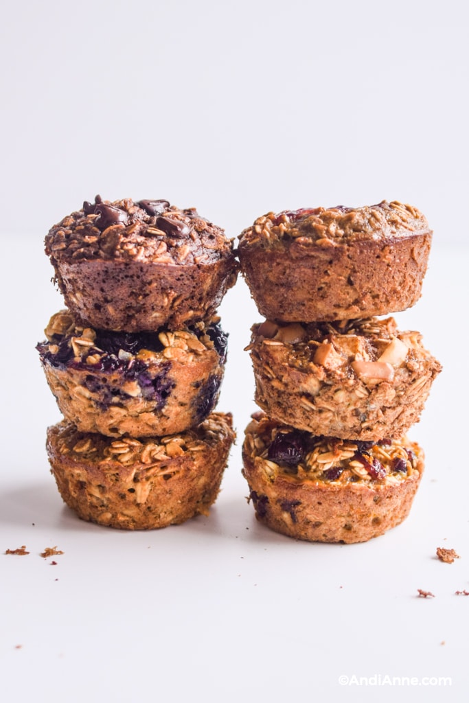 baked oatmeal breakfast cups stacked in three's on a counter