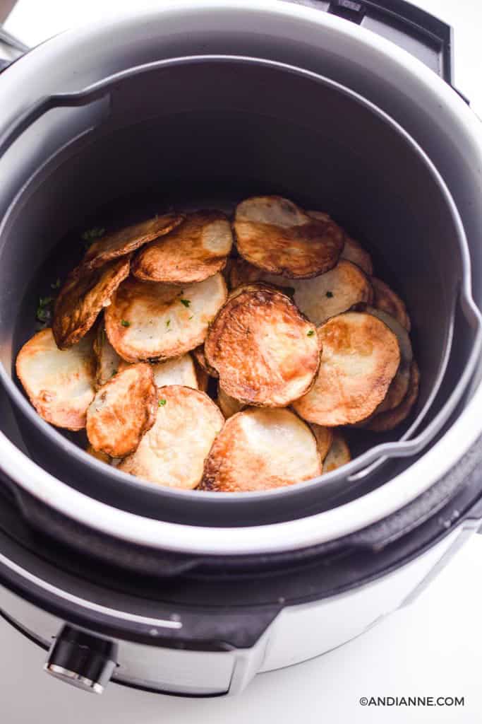 crispy potato chips in a black air fryer