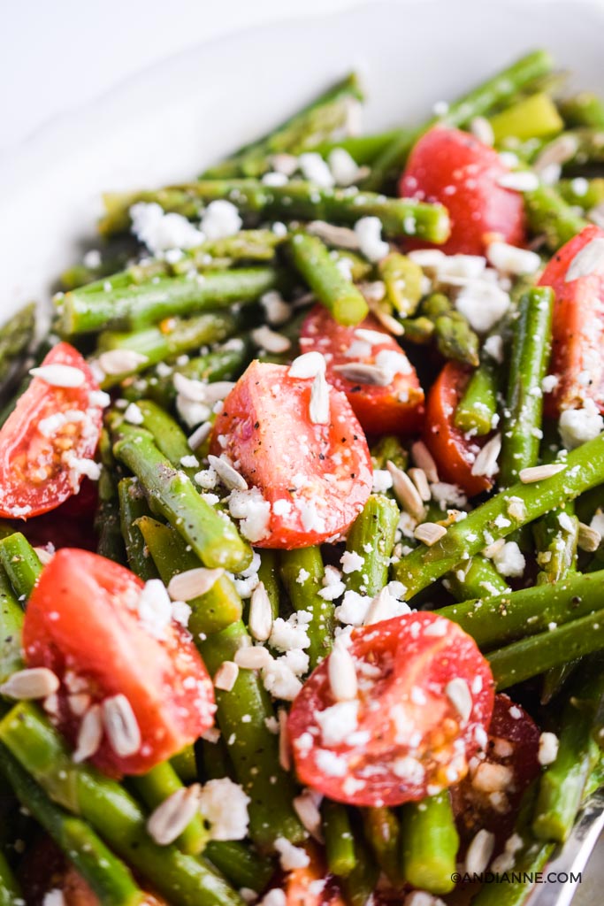 close up of tomatoes, asparagus, feta salad