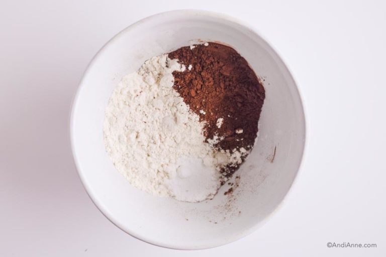 flour, cacao powder, baking soda and salt in a white bowl