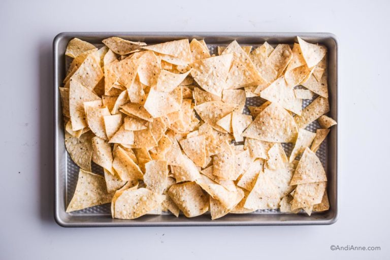 tortilla chips laid on to a baking sheet