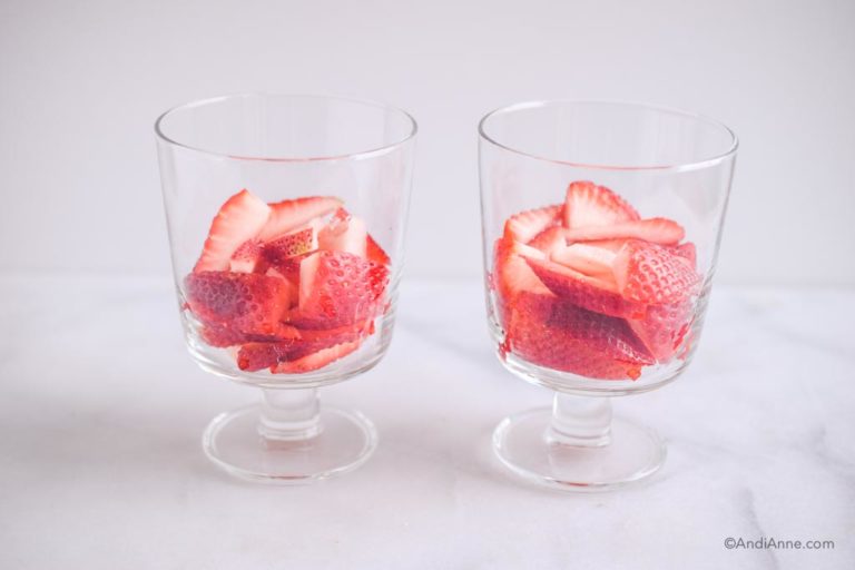 sliced strawberries in two glass cups