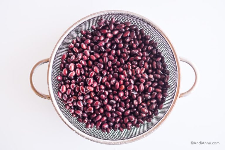 black beans in a metal strainer