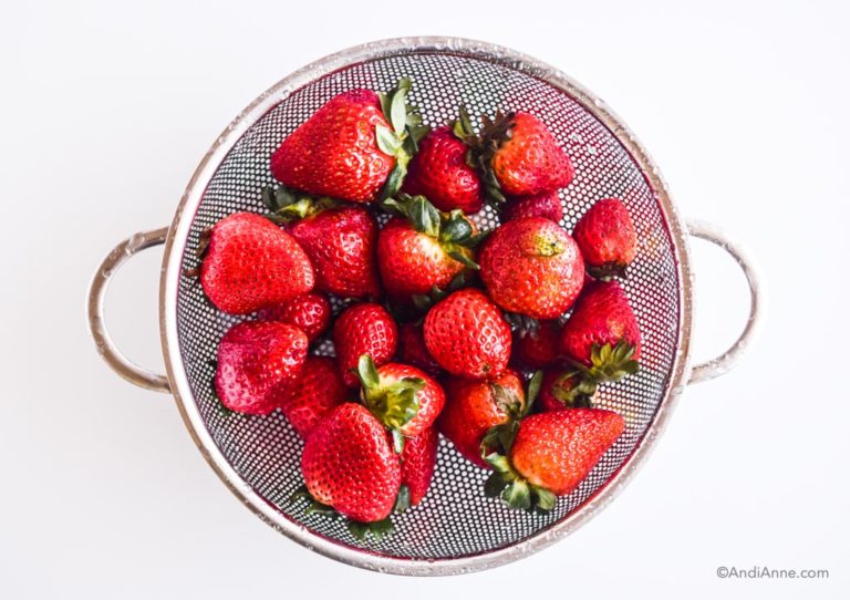 strawberries in a strainer