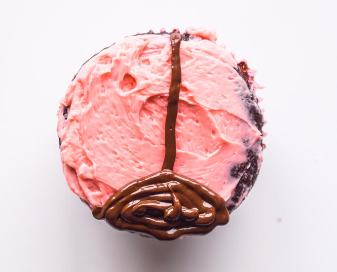 chocolate on pink icing on cupcake