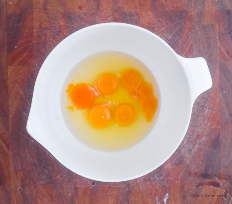 5 eggs in a white bowl