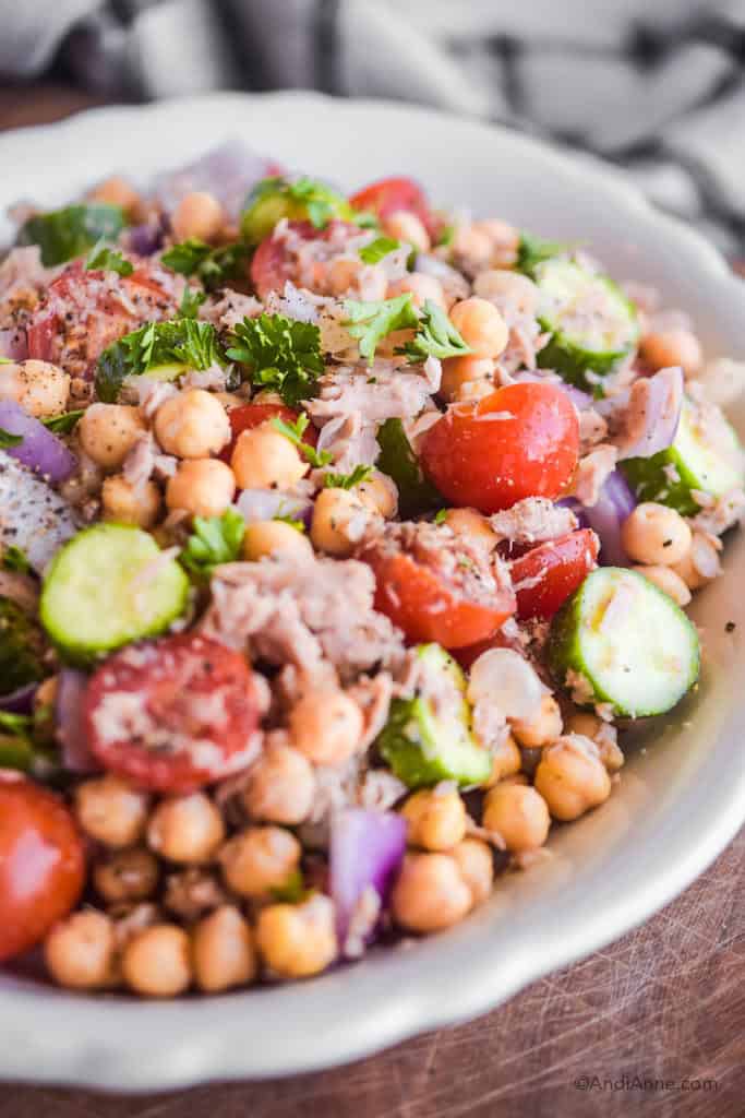 close up of chickpea lemon tuna salad in a white bowl