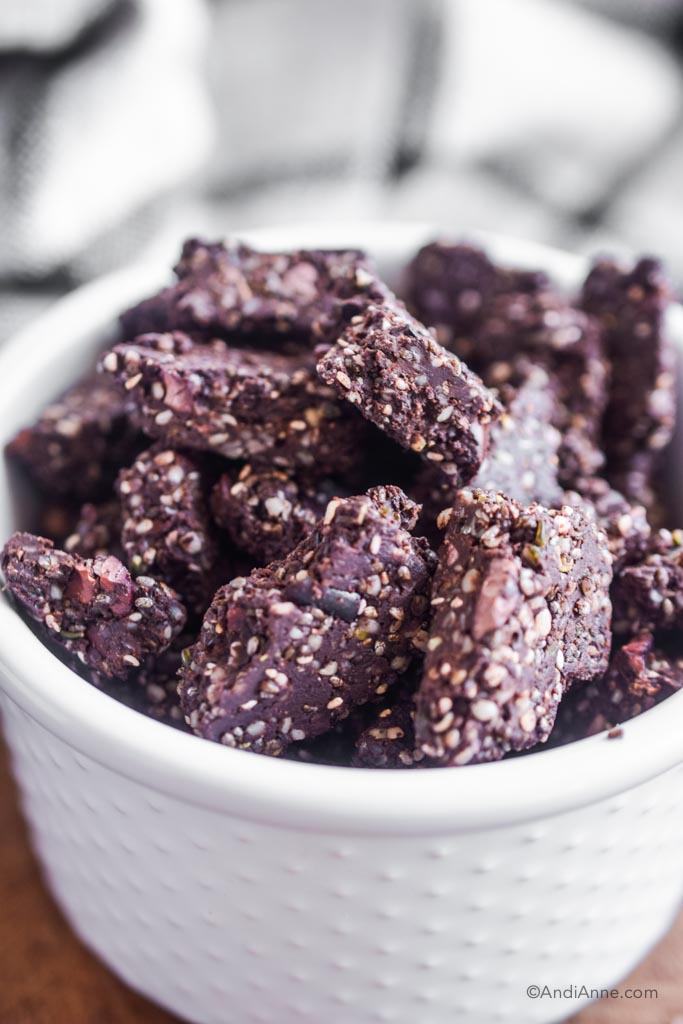 close up of chocolate protein chia bites in a white bowl