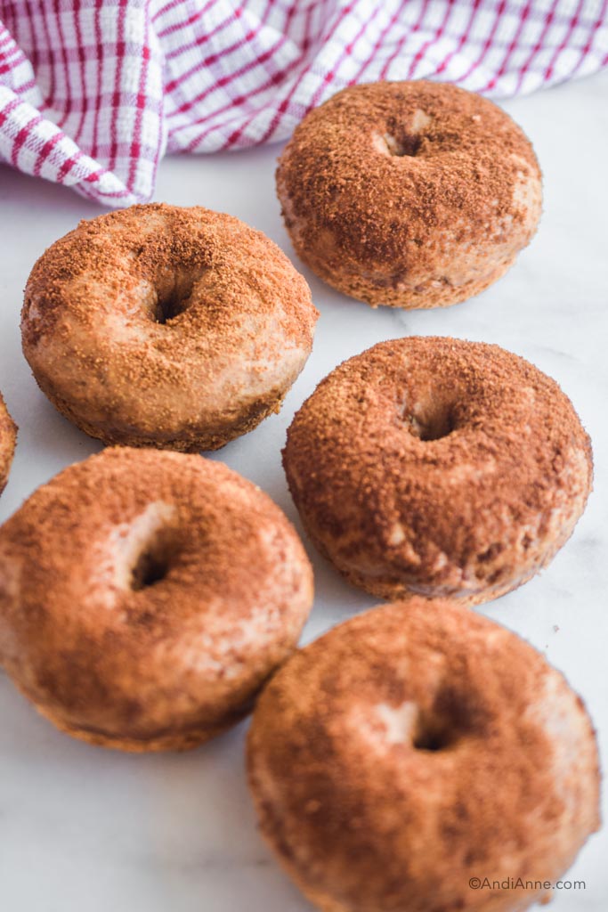 cinnamon sugar baked donuts on a white table