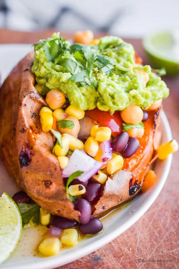 Close up of taco stuffed sweet potatoes on a white plate