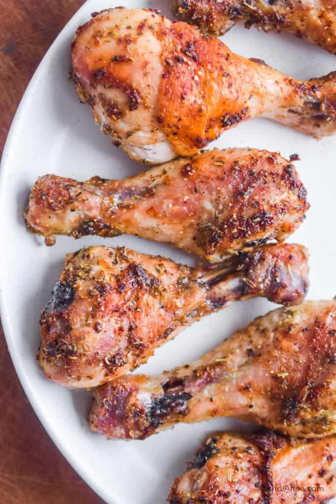 baked chicken drumsticks on a white plate