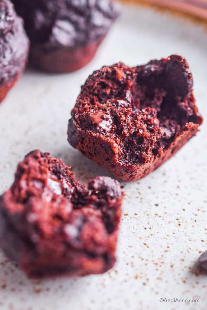 close up of chocolate mini muffin in half, looking at the inside