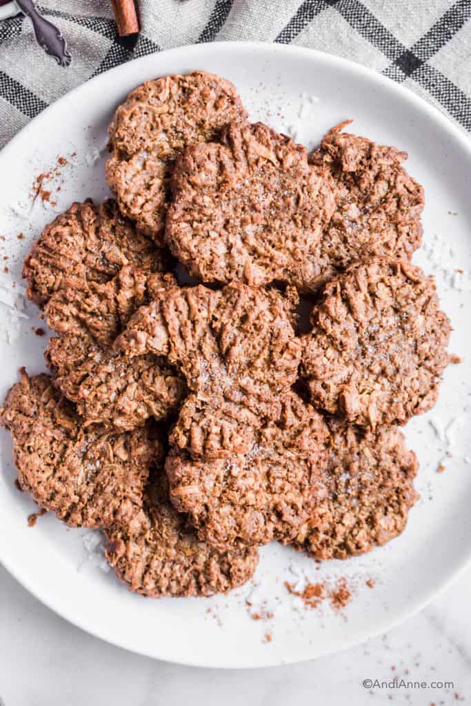 coconut cinnamon ginger cookies stacked together on a white plate