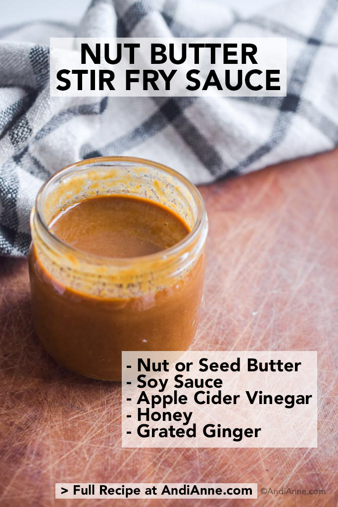 nut butter stir fry sauce on wood cutting board with kitchen towel behind it