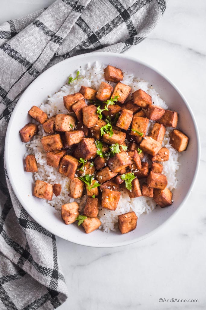 crispy air fryer tofu with white rice on a white plate
