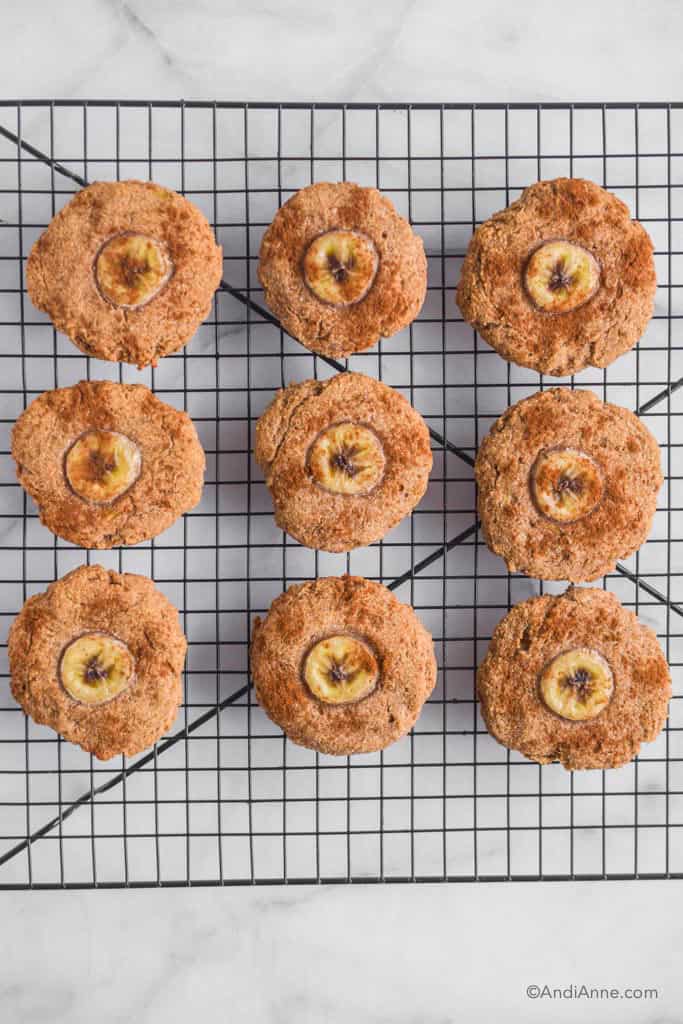 Banana bread cookies on a black cooling rack.