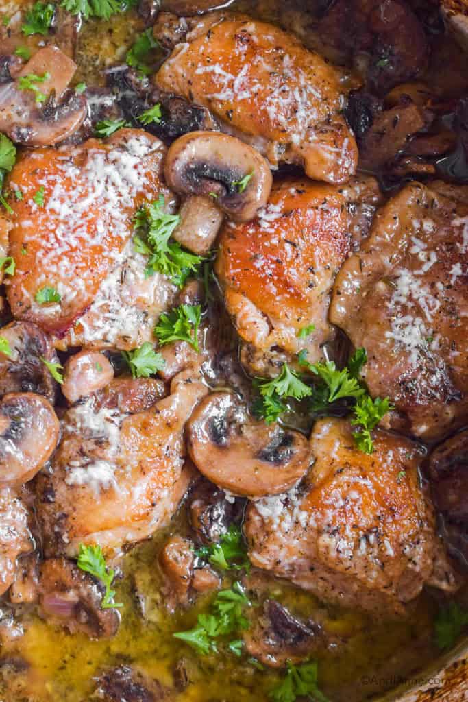 close up of cooked chicken thighs in mushroom sauce