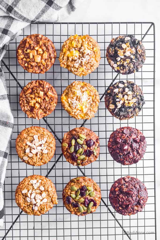 Cooked oatmeal muffins cooling on a black rack.