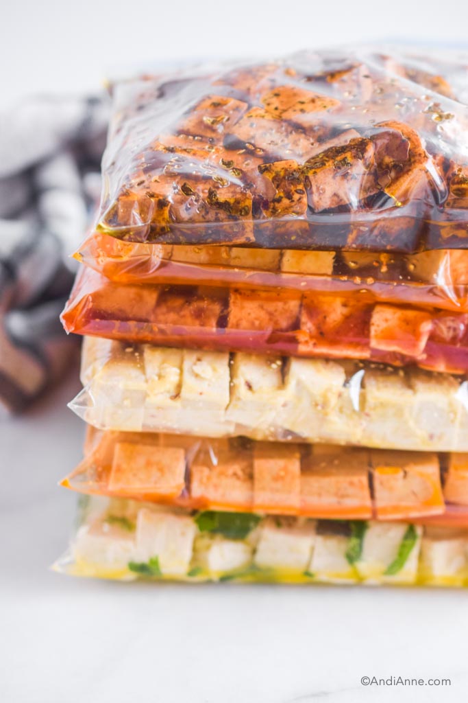 Close up of tofu marinade bags stacked on top of eachother.