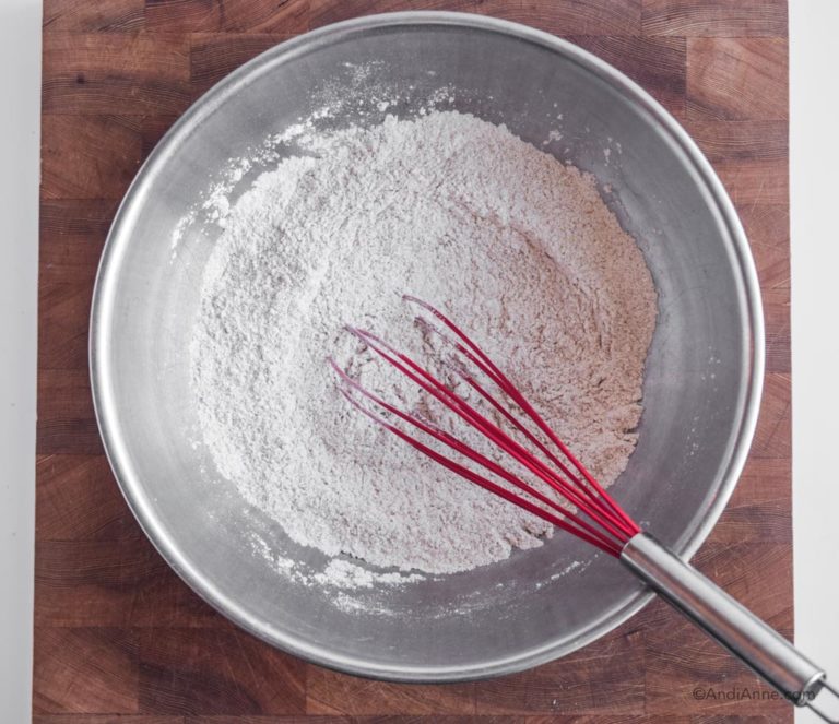 flour mix in steel bowl with red whisk