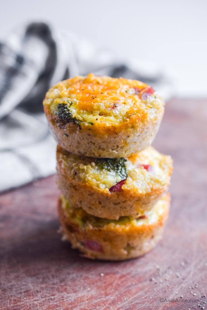 three quinoa breakfast muffins stacked on top of eachother