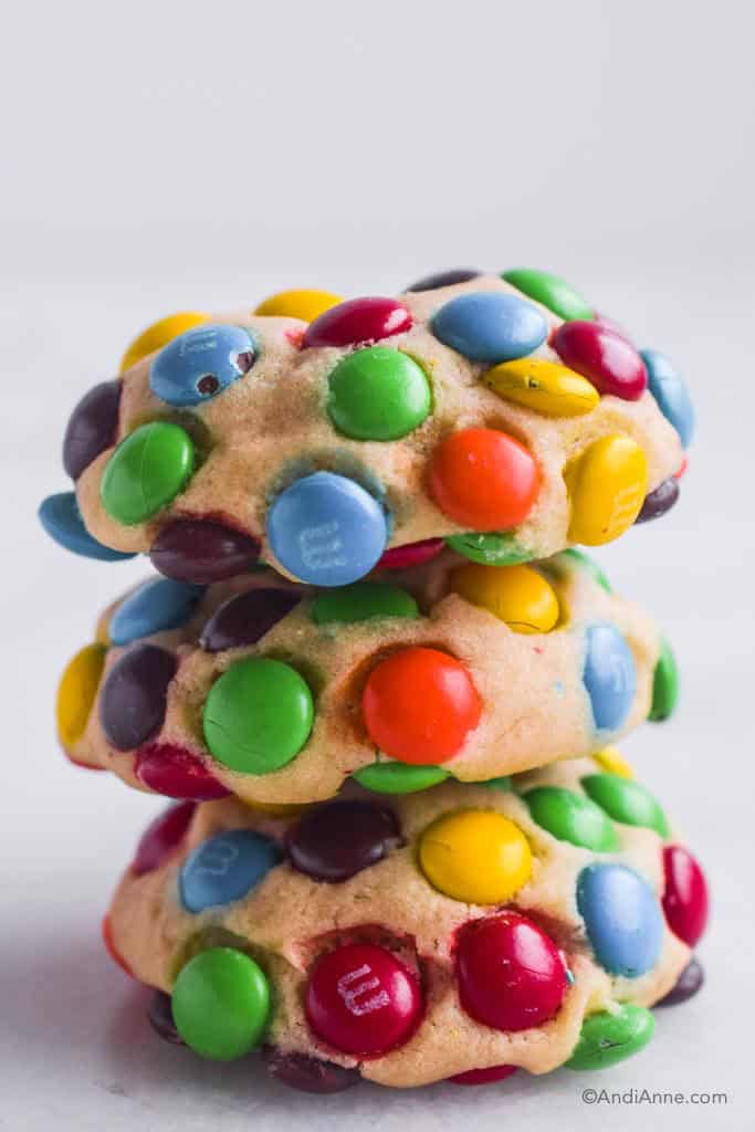 Three mini M&Ms cookies piled on top of eachother.