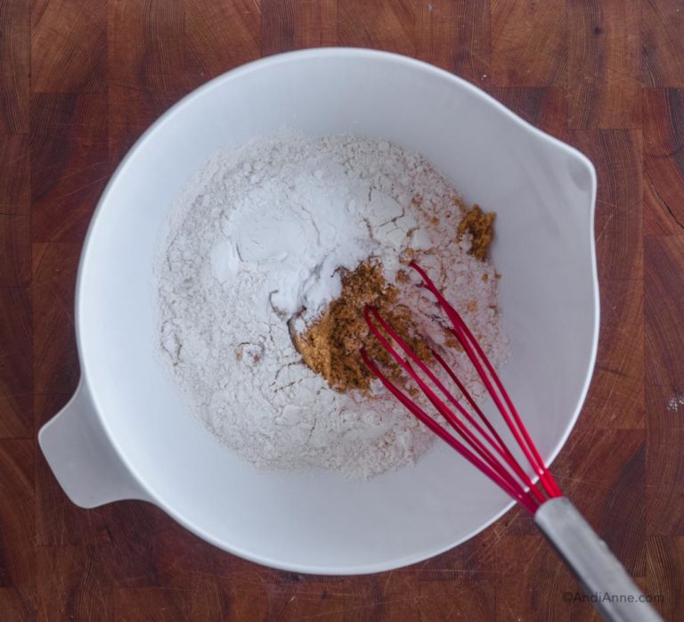 white bowl with flour and whisk