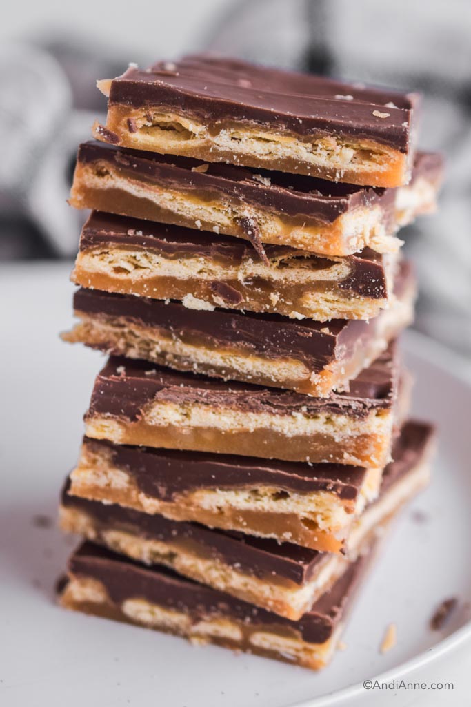 cracker candy stacked on top of each other to form a high pile.