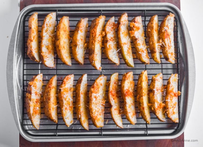 uncooked fries on baking rack