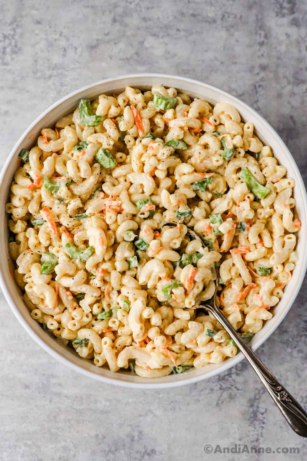Spoon holding the macaroni salad