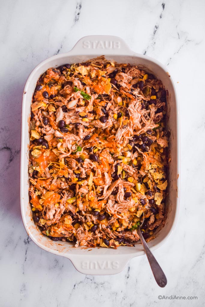 shredded barbecue chicken casserole with spoon.
