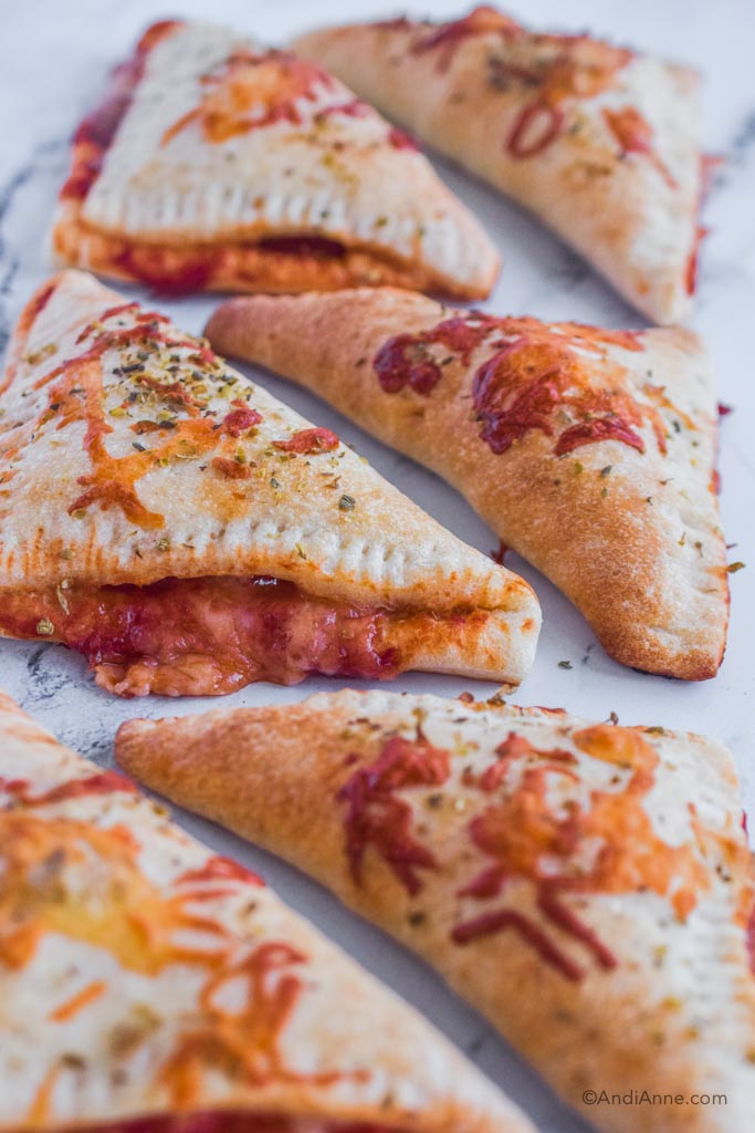 Close up of pizza pockets on marble counterspace