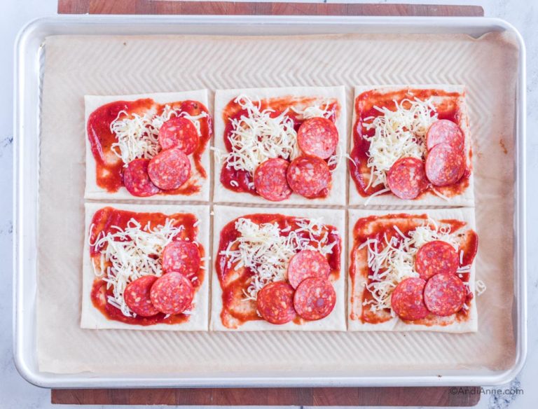 dough squares with sauce, shredded mozzarella and pepperoni slices