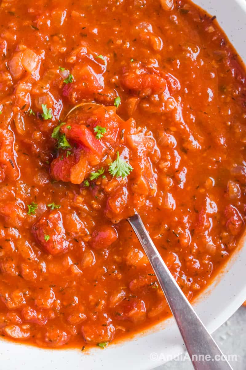 Close up of soup with a spoon.