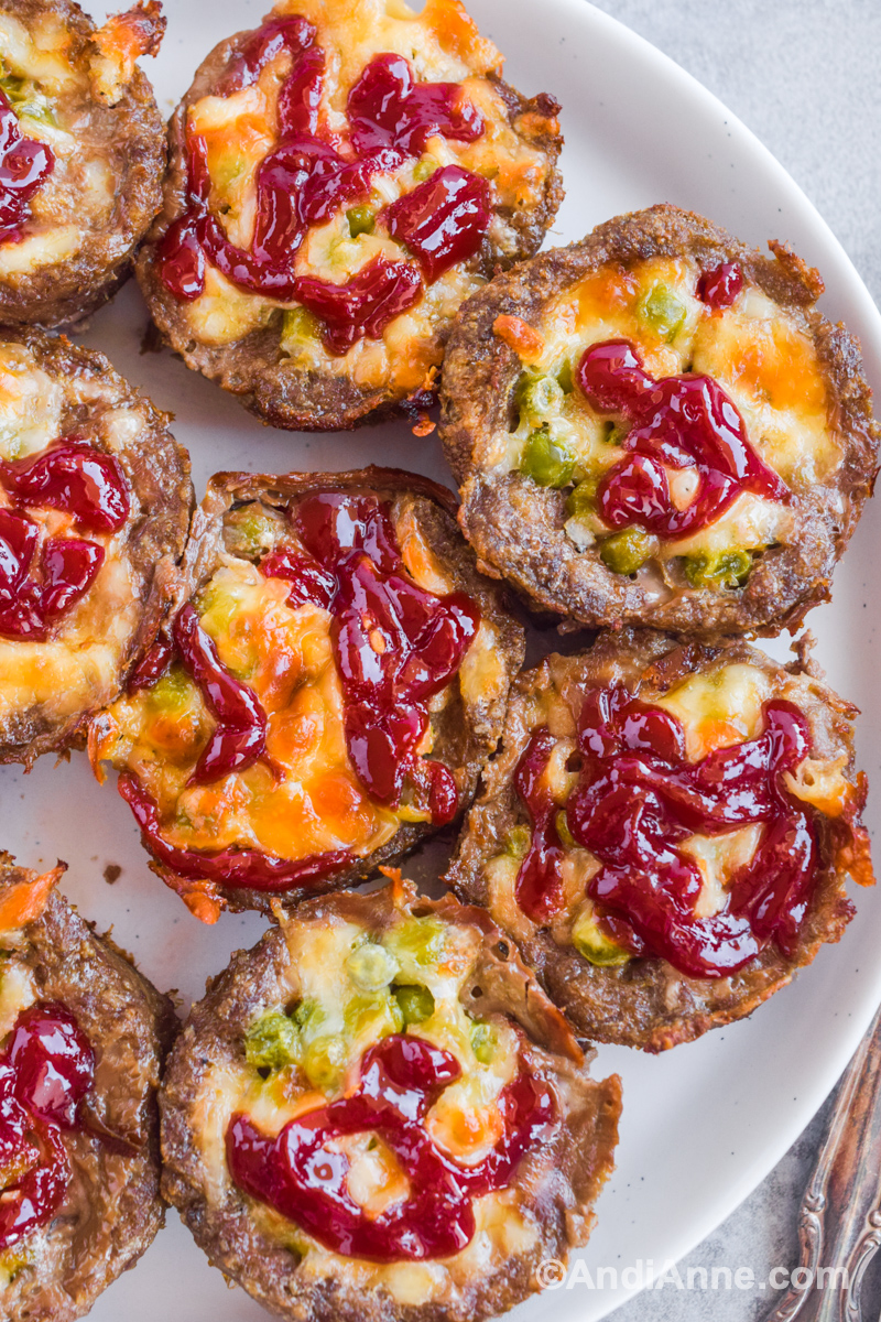 Meatloaf muffins with cheese and ketchup on top. 