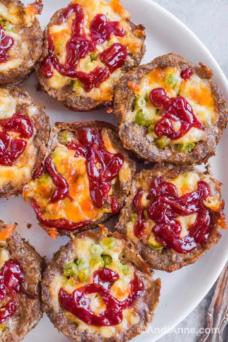 Close up of meatloaf muffins on a white plate.