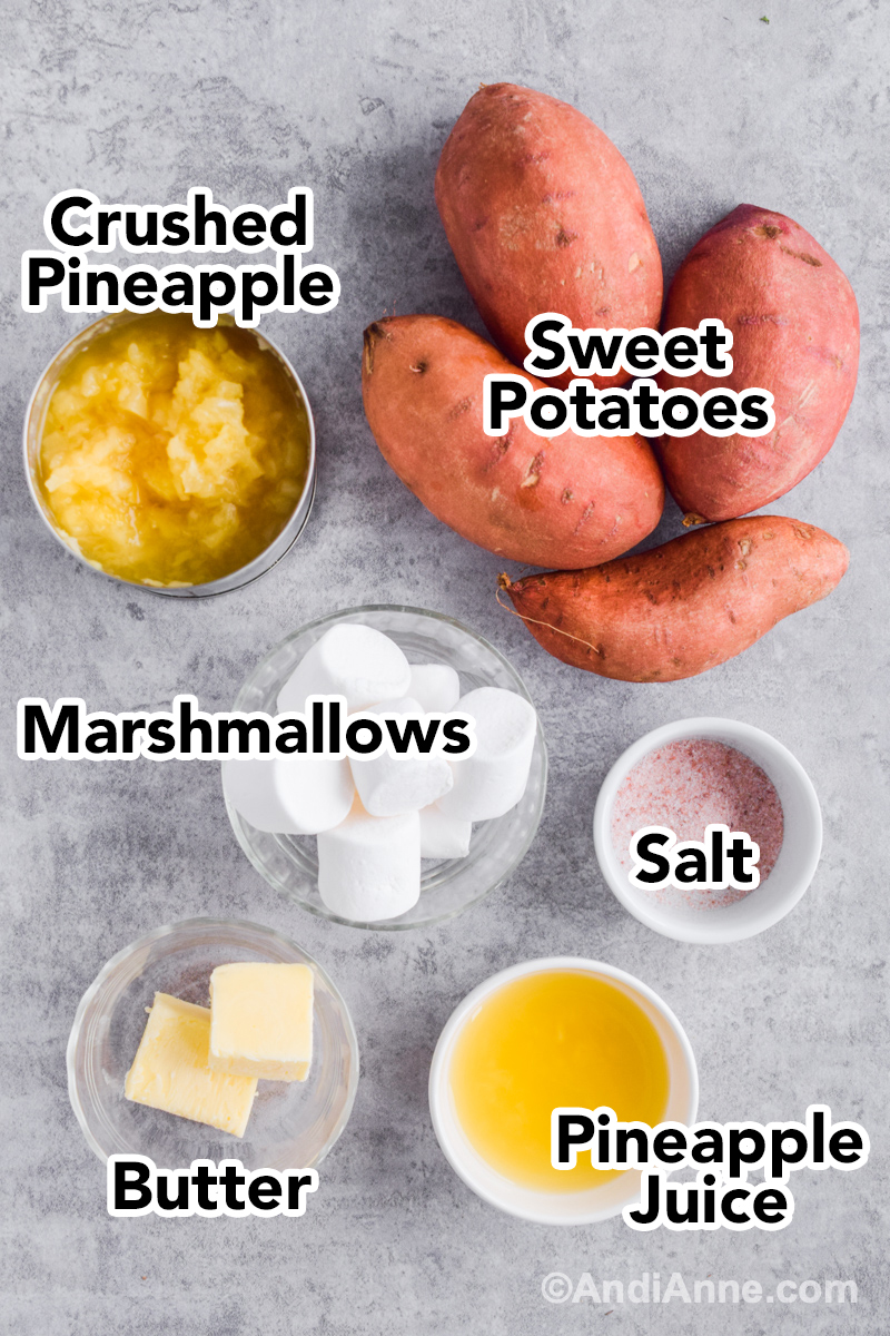 Recipe ingredients on counter including sweet potatoes, can of crushed pineapple, bowl of marshmallows, salt, butter and pineapple juice.
