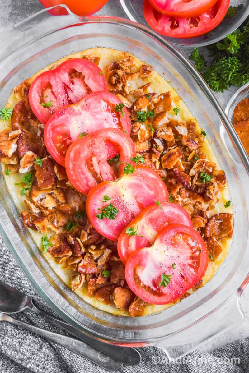 mashed turnip casserole with crunchy cracker topping and fresh tomato slices.