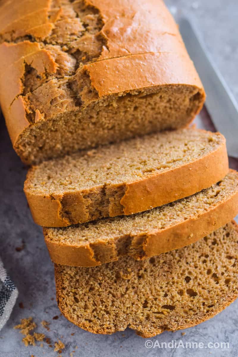 Looking down at the peanut butter loaf cut into slices with a few slices falling over.