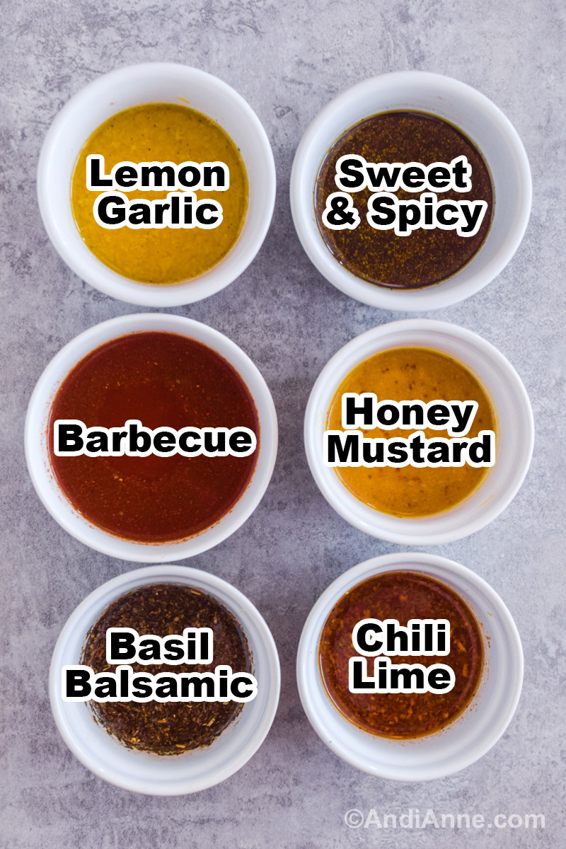 Six small white bowls with different marinade sauces including lemon garlic, sweet and spicy, barbecue, honey mustard, basil balsamic, and chili lime.