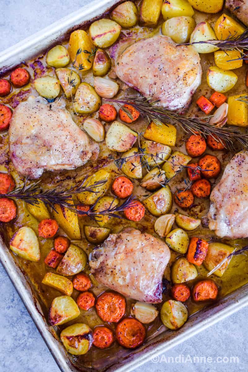 Another angle of the baked chicken and vegetables on the sheet pan.