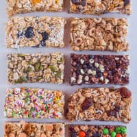 Various different granola bars on a white surface.