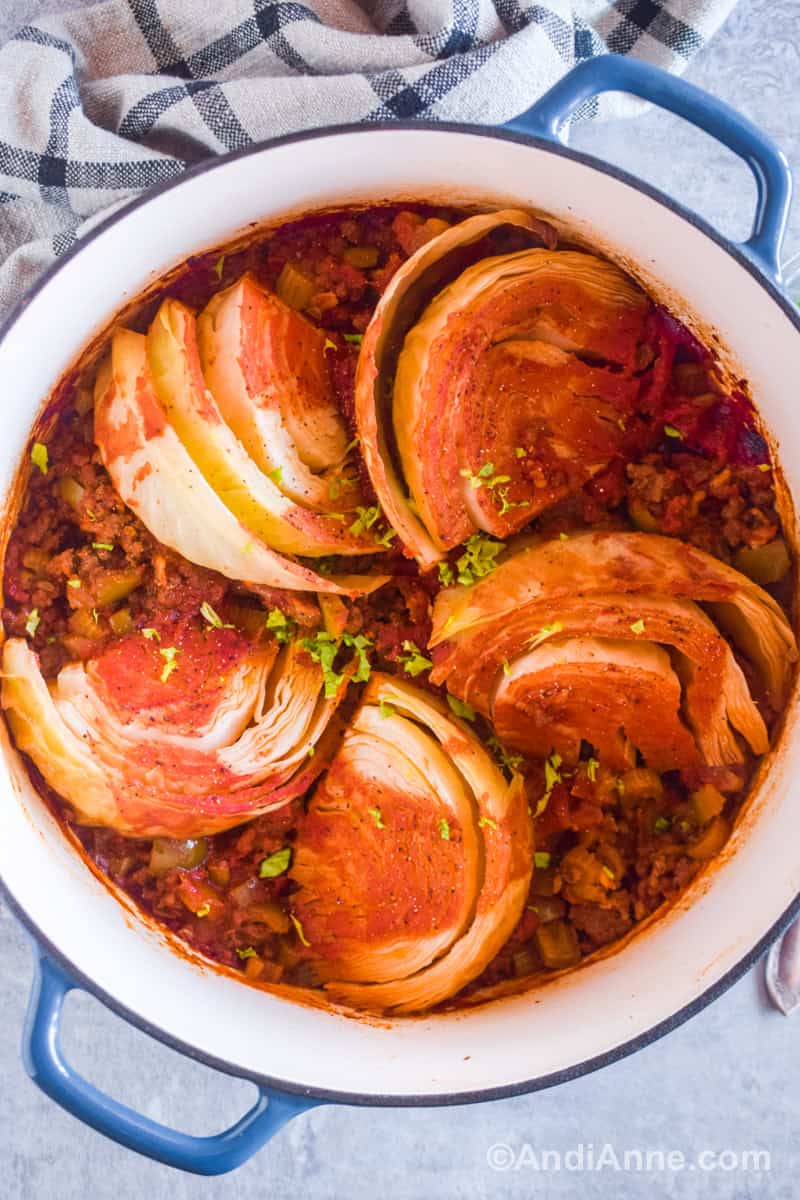 A large white pot with the sweet and sour beef and cabbage recipe inside.
